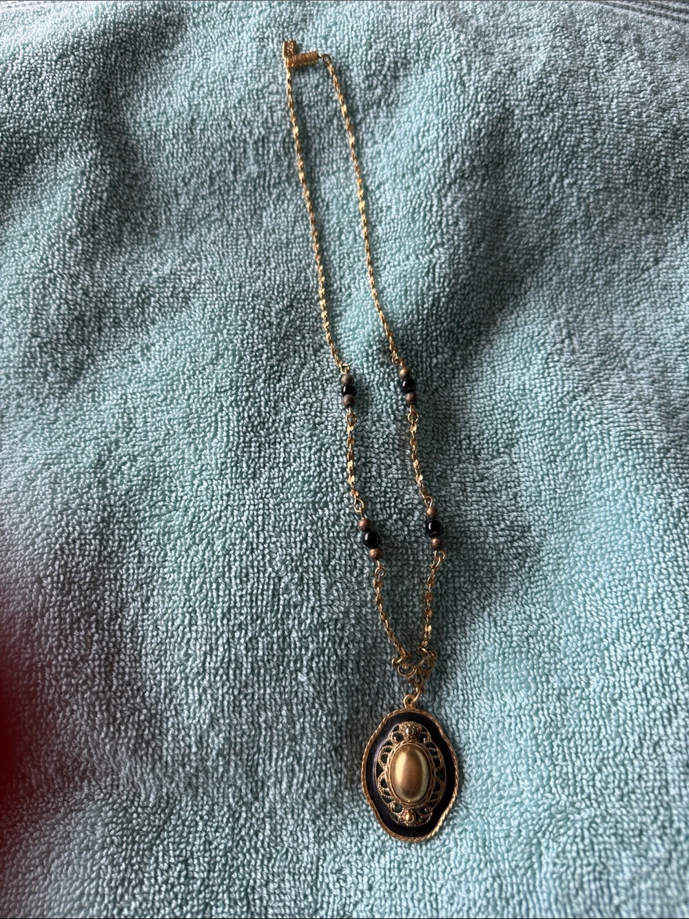 1928 Gold and Black Oval Pendant Necklace
